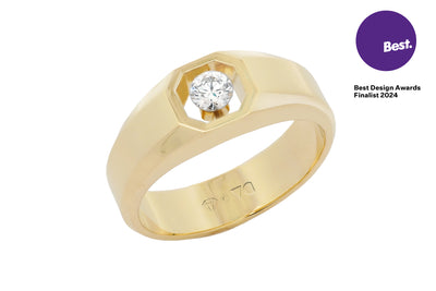 The Floeting Diamond Signet Ring crafted in 18ct yellow gold and titanium, designed for all genders. Best design awards finalist 2024