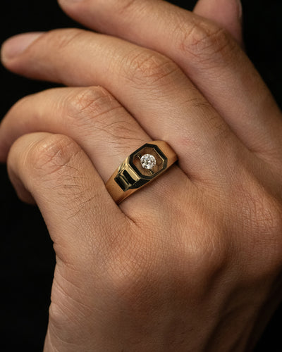 The Floeting Diamond Signet Ring crafted in 18ct yellow gold and titanium that is designed for all genders