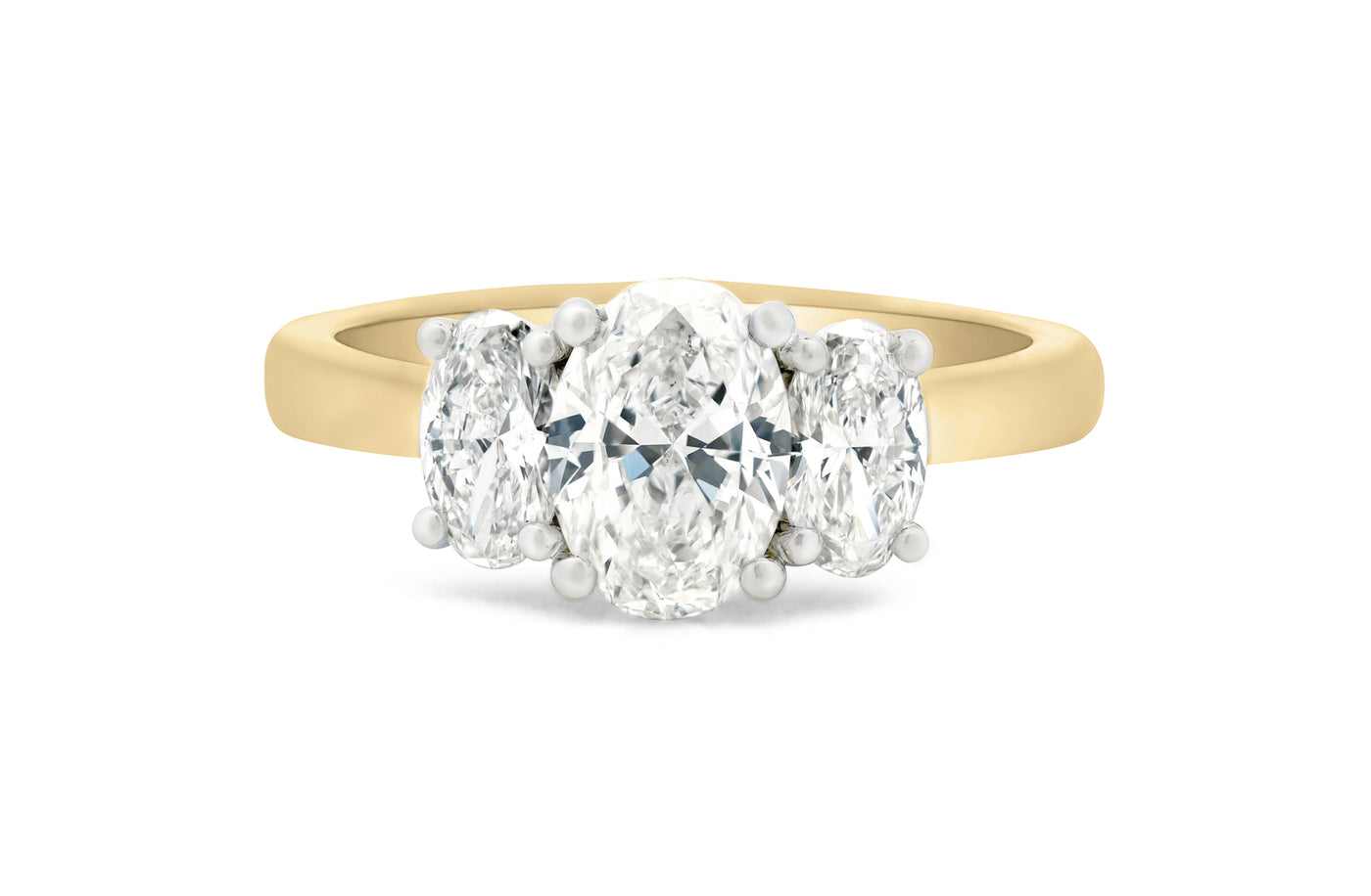 Harmony: Oval Cut Diamond Three Stone Ring in Yellow Gold and Platinum